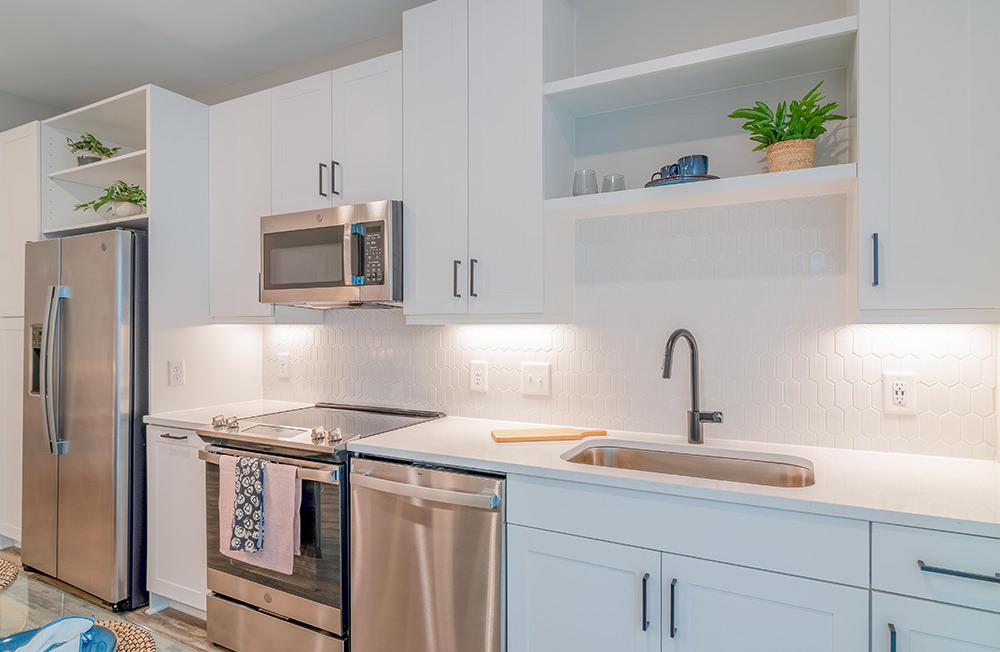 Open kitchen and living room with plenty of natural light.