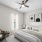bedroom with one window and ceiling fan with bed, side table and chair
