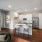 kitchen with white cabinets and kitchen island with stools