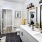 Model bathroom at our apartments in Atlanta, featuring tiled floor panels and white countertops and cabinetry.