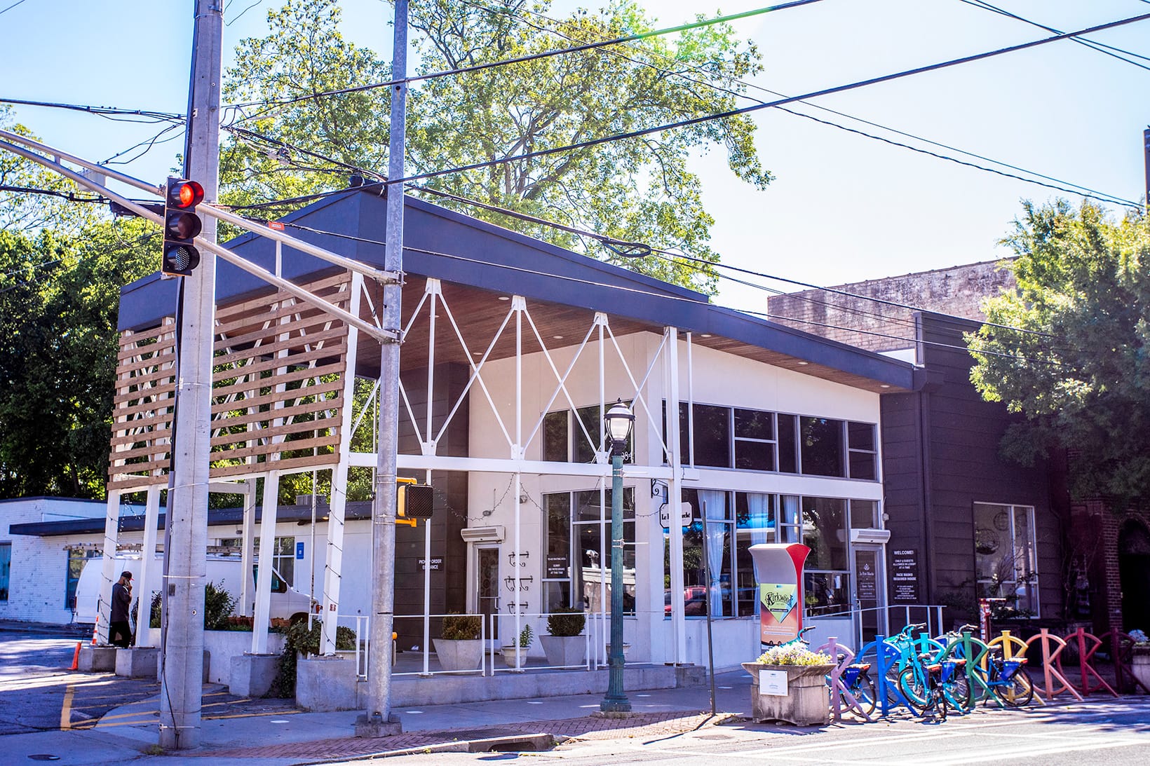 Photograph of a store near our apartments in Atlanta, featuring  rows of bikes parked outside and a view of the streets.